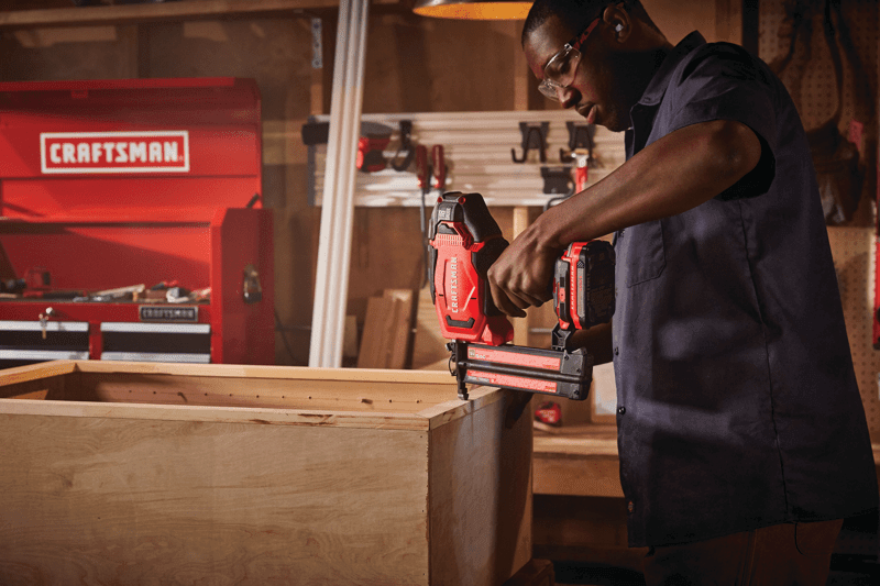 20 volt 18 gauge cordless brad nailer kit being used by a person indoors.