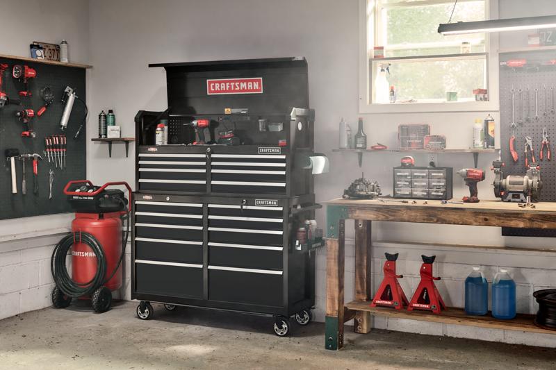 52 inch 8 drawer tool chest placed on top of rolling tool cabinet in workshop.